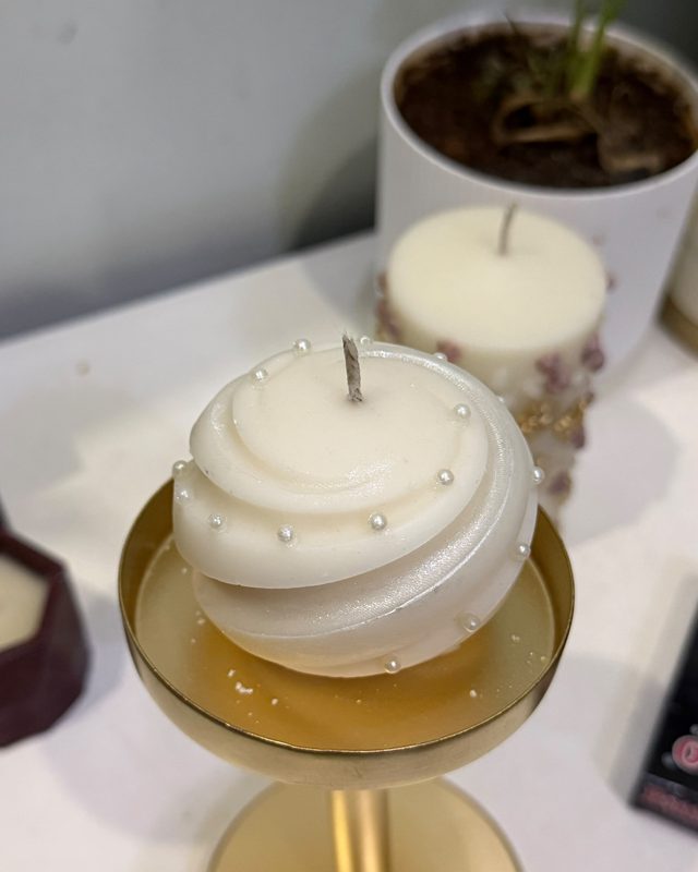 Pearls pressed into a spiral candle
